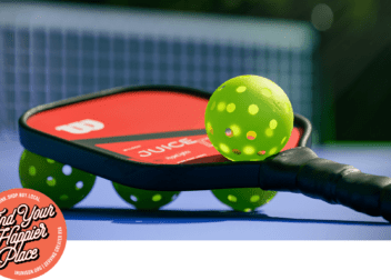 pickleball paddle and balls on a court