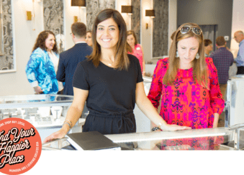 A woman behind a jewelry display counter