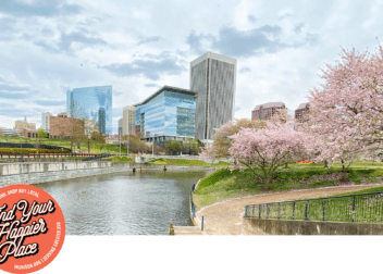 the canal with cherry blossoms and the Richmond skyline in the background