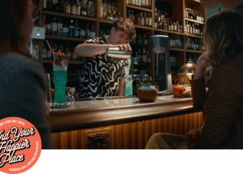 a bartender at a local richmond bar pours a drink